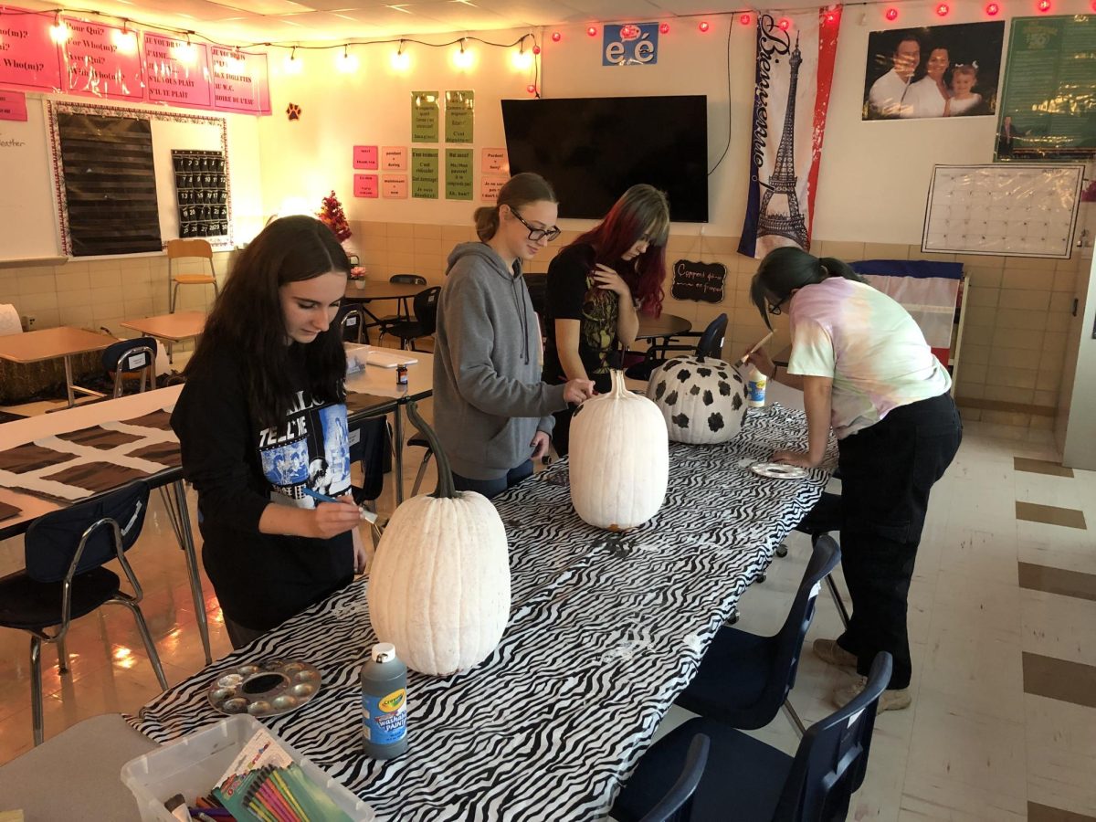 French Club working on Halloween Party decorations during Club Day.