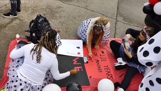 ASL club students working on and adding finishing touches to their dalmatian themed trunk